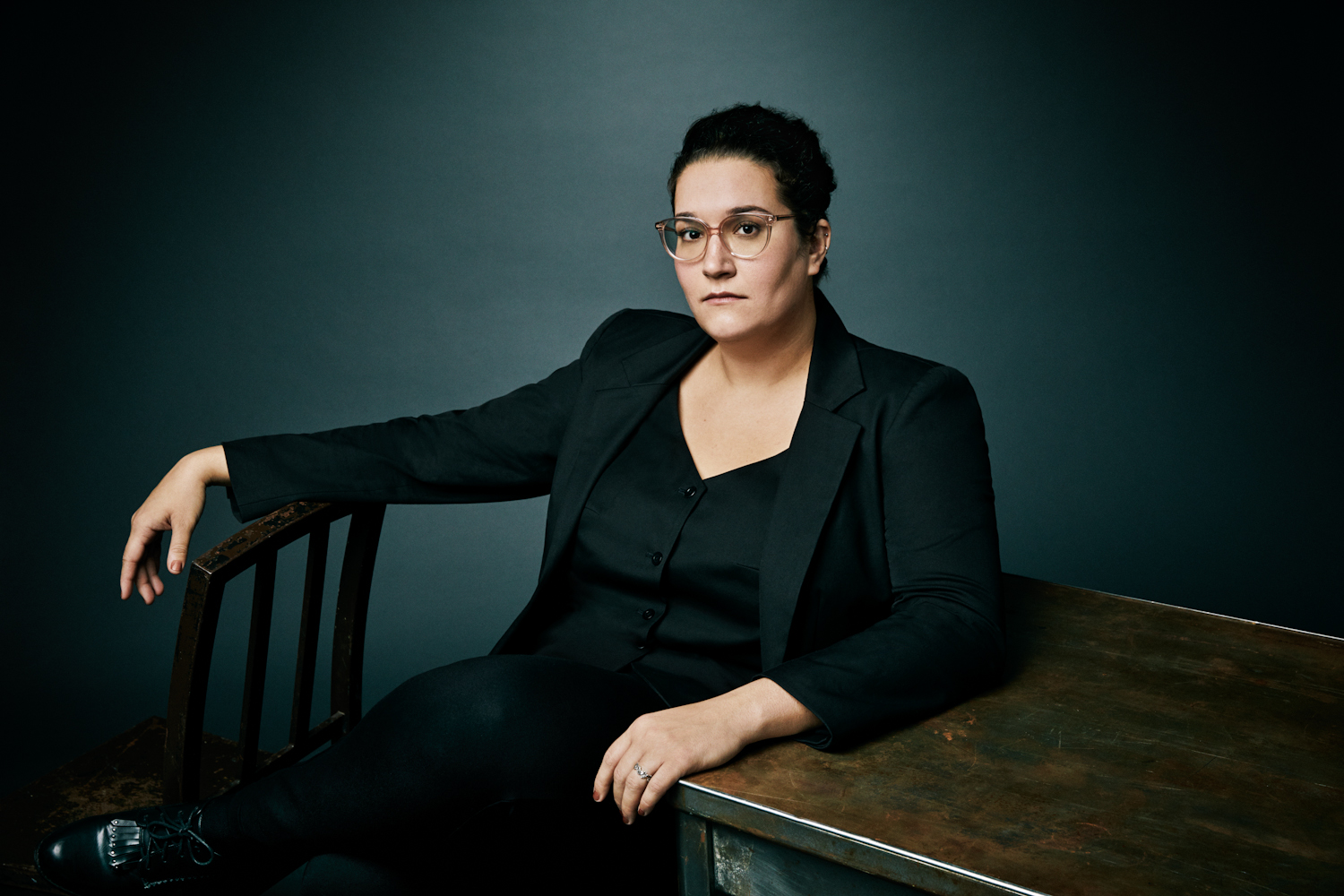 Photograph of author Carmen Maria Machado sitting in a chair